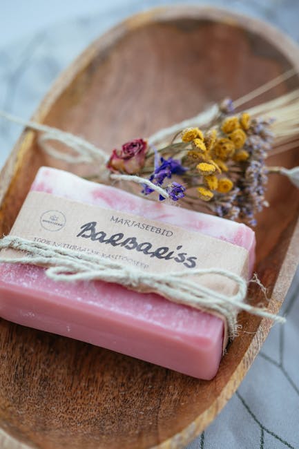 Handmade cold process soap bars curing on a rack