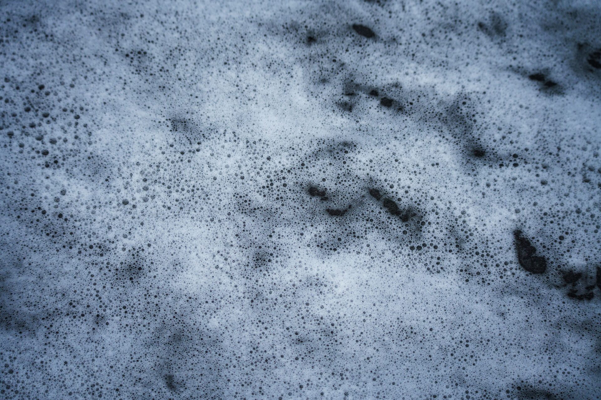 Fluffy soap lather bubbles from a coconut oil bar